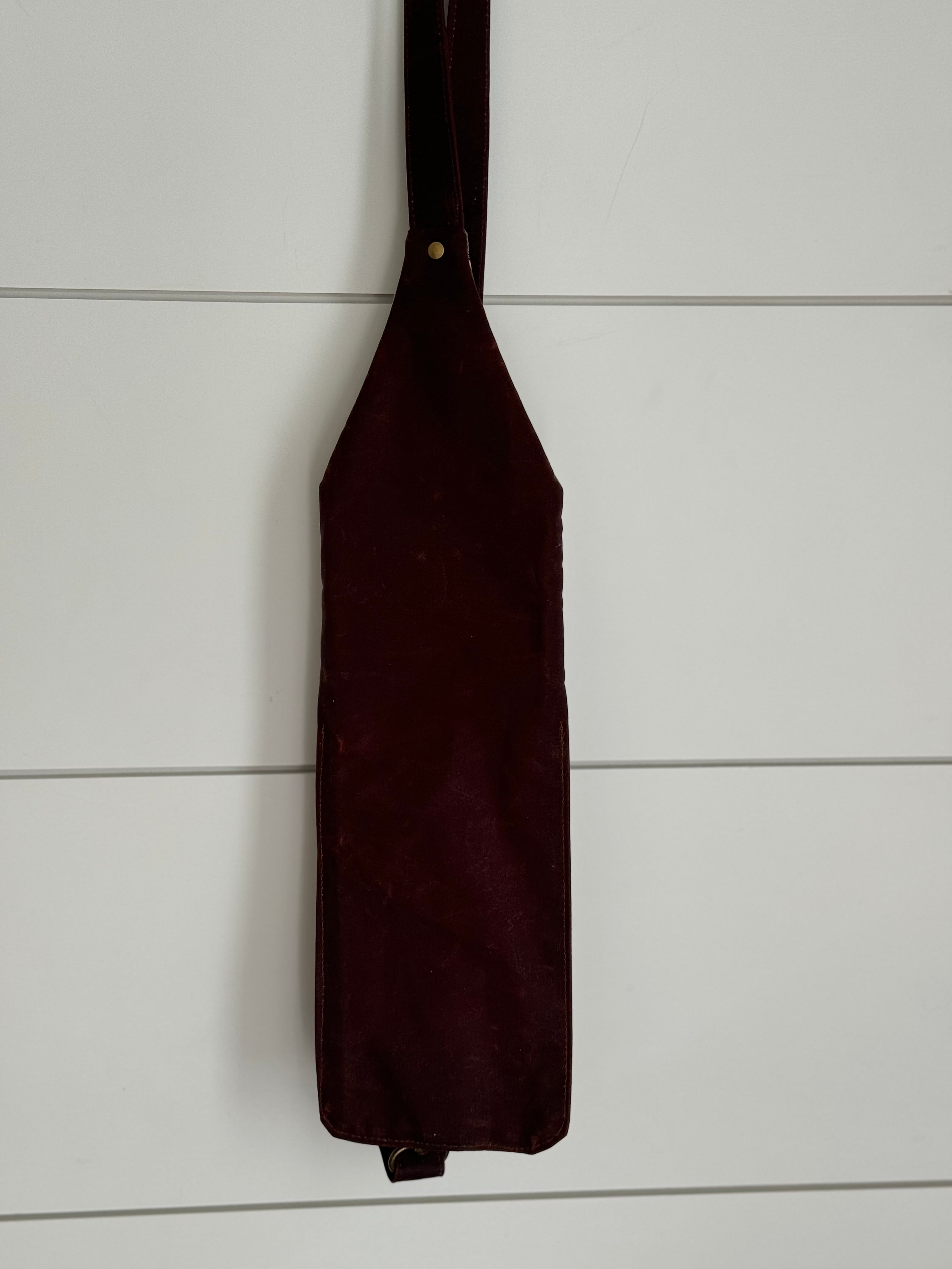 Back of Ella crossbody bag hanging with white background
