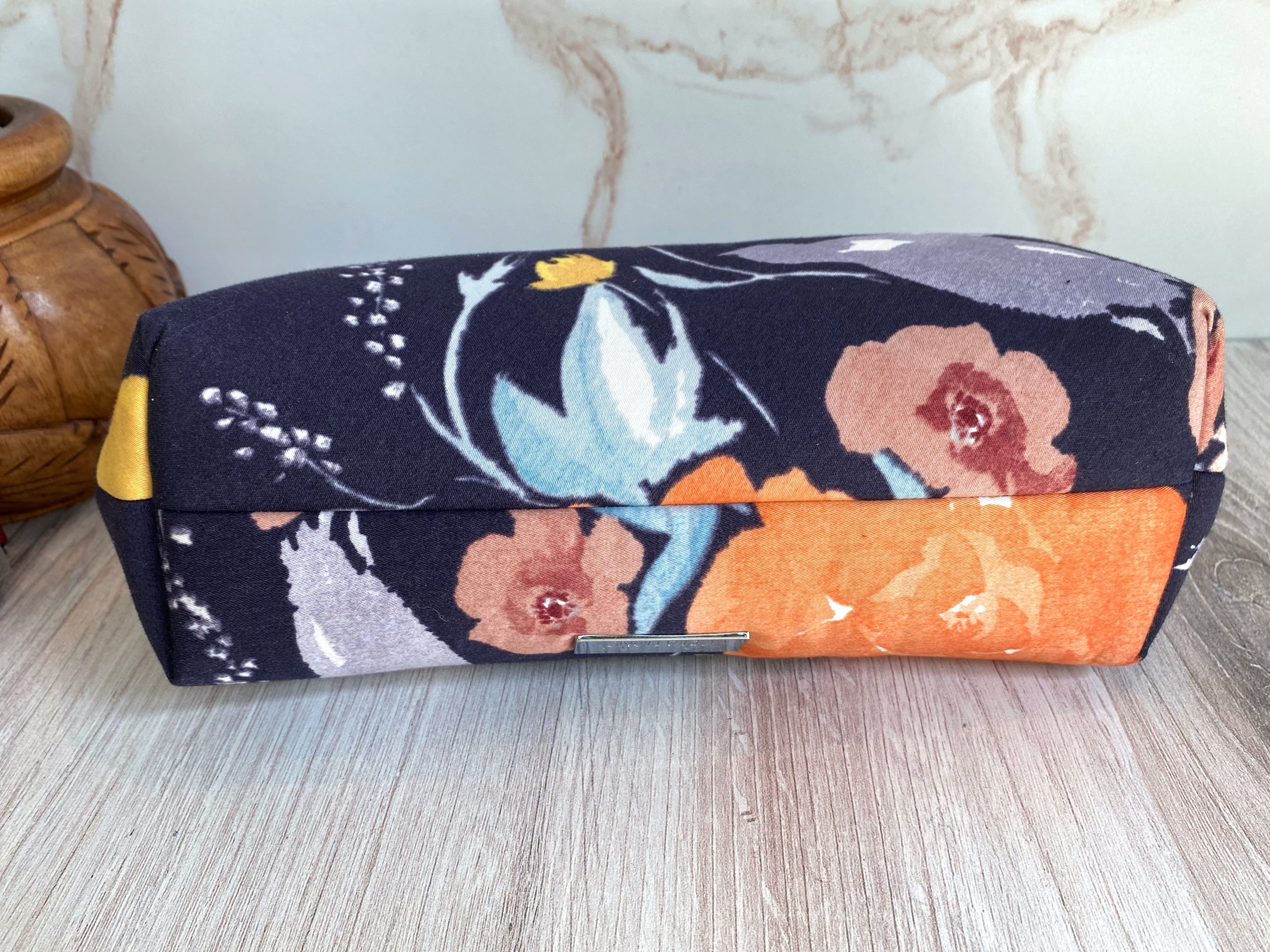 Bottom view of Kisslock clutch showing fabrics' seams and construction as well as close up views of the Japanese fabrics.