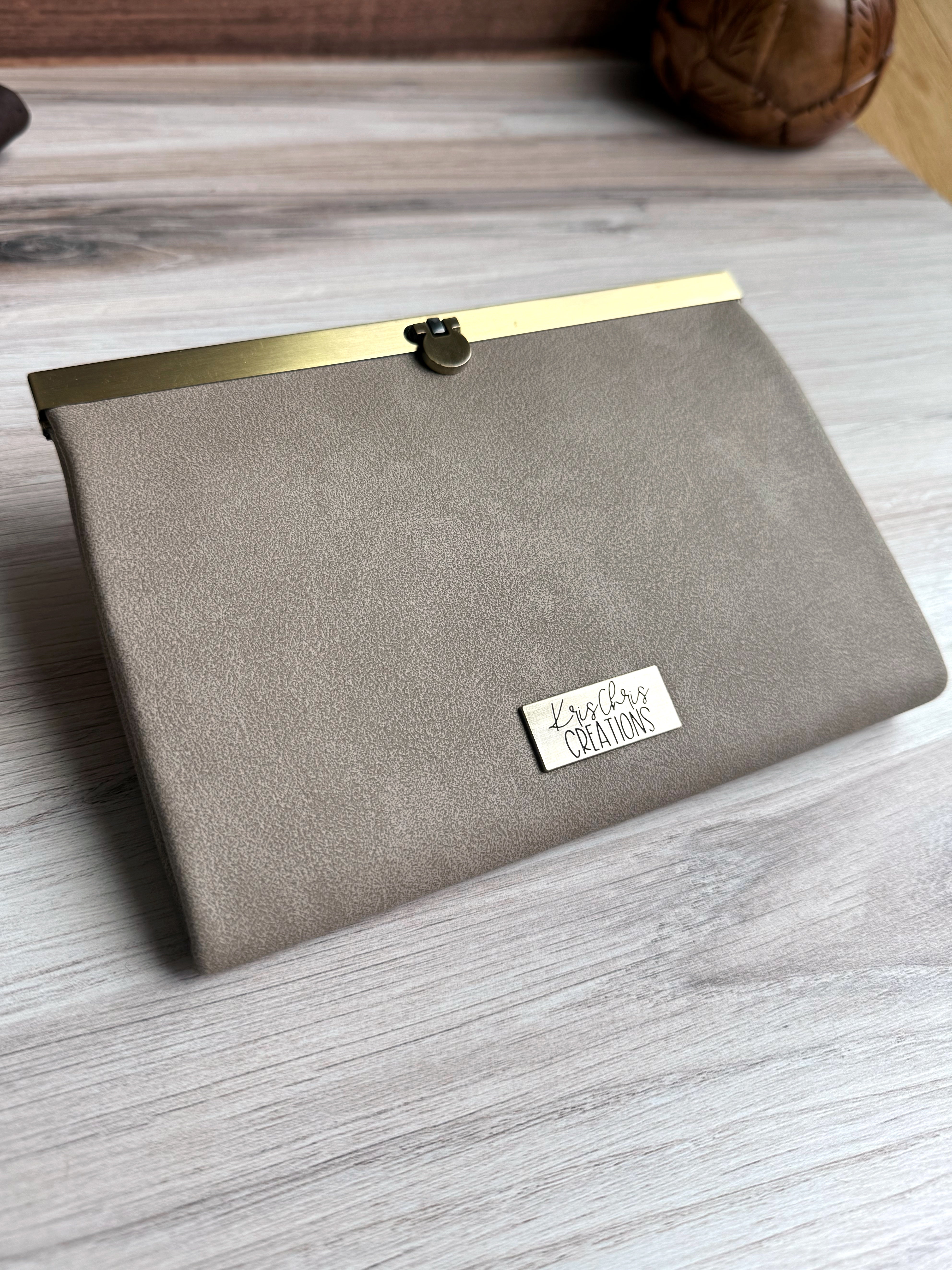Gray/Tan accordion style wallet with a sleek exterior, antique brass metal clasp at top and coordinating KrisChris metal label.