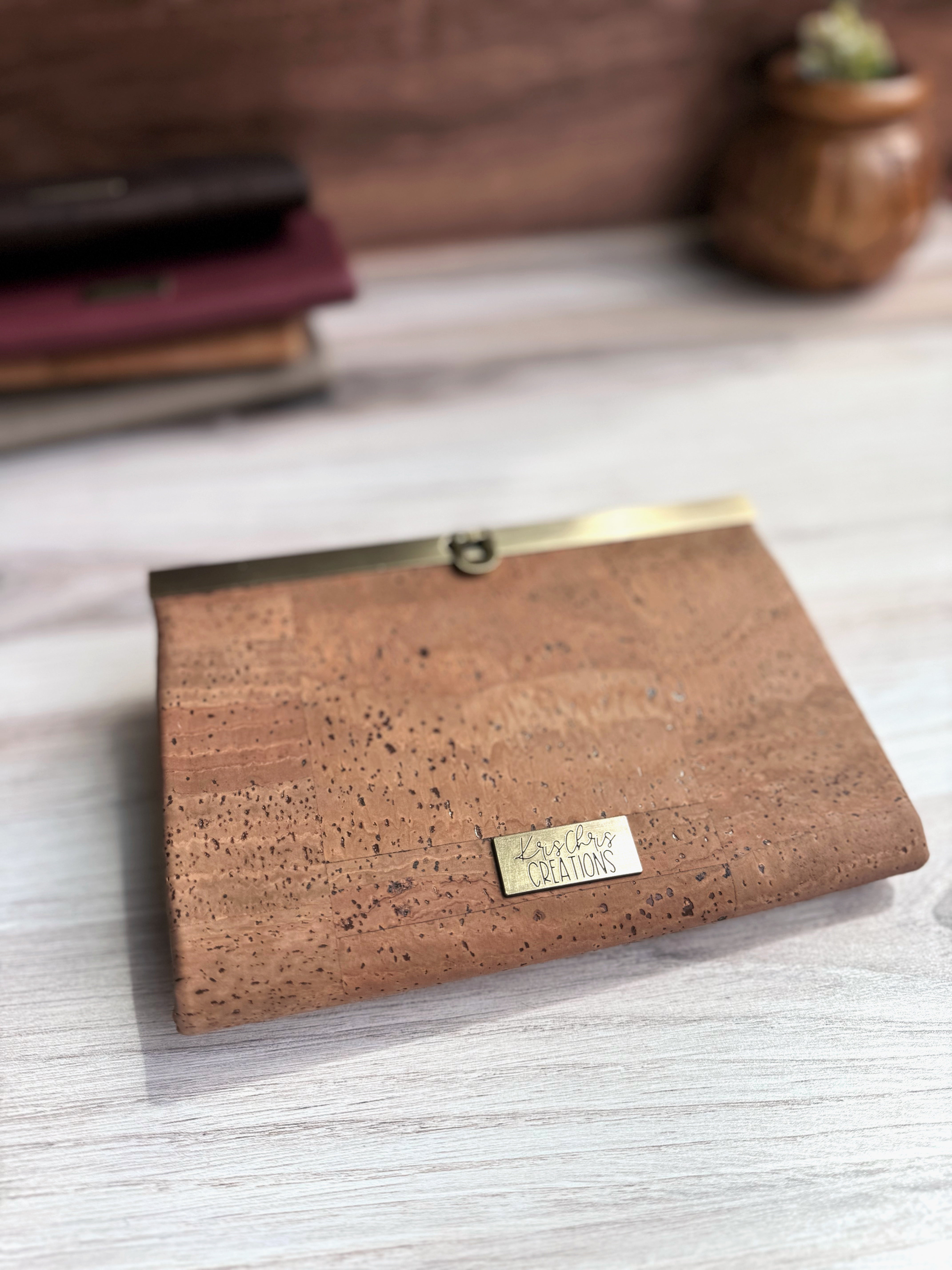 Natural Brown Cork Accordion Wallet with Antique Brass Clasp along Top Edge and KrisChris brass tag.
