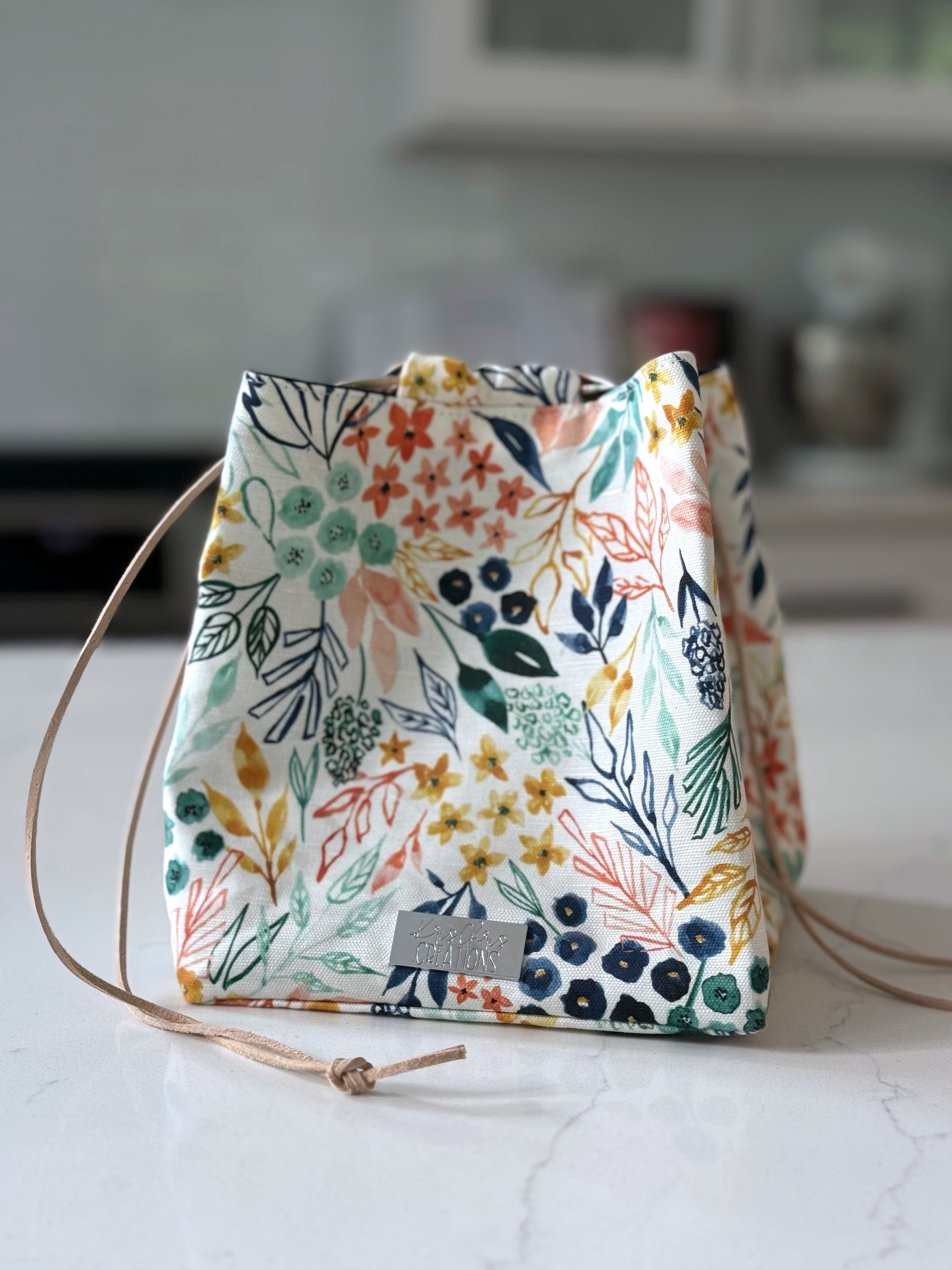 The Pat Pouch - Japanese Drawstring Bag in Colorful Floral Canvas and Navy Waxed Canvas Lining - KrisChris 