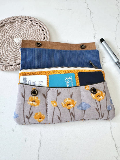 Fabric pouch with floral pattern on a white surface