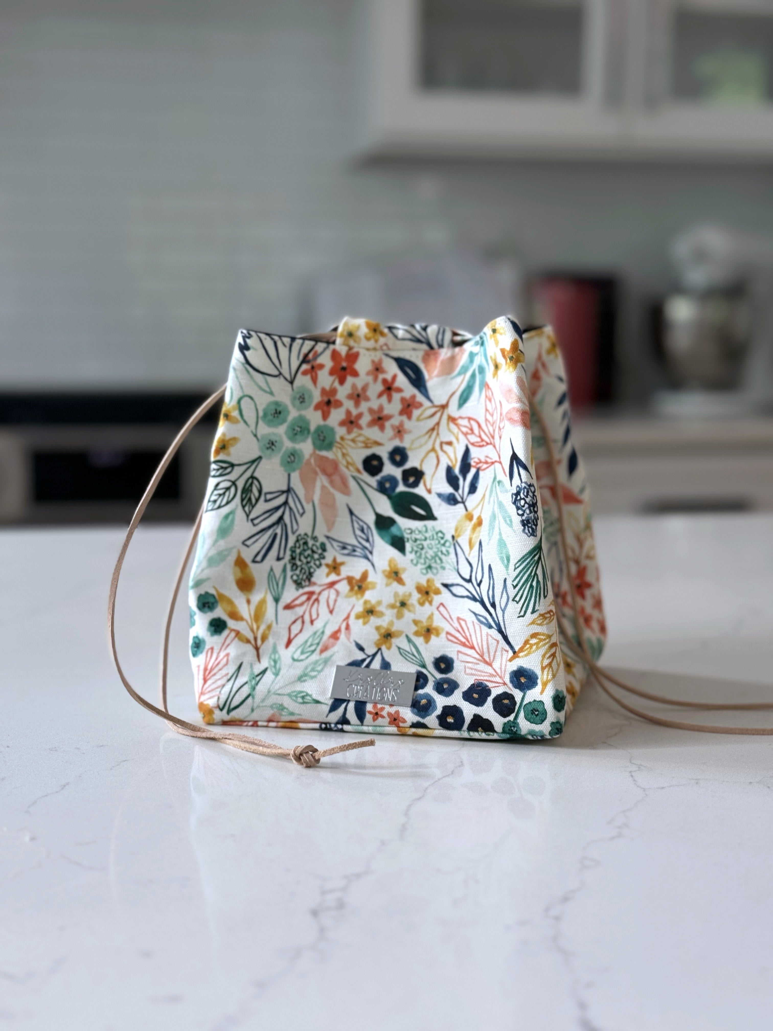 The Pat Pouch - Japanese Drawstring Bag in Colorful Floral Canvas and Navy Waxed Canvas Lining - KrisChris 