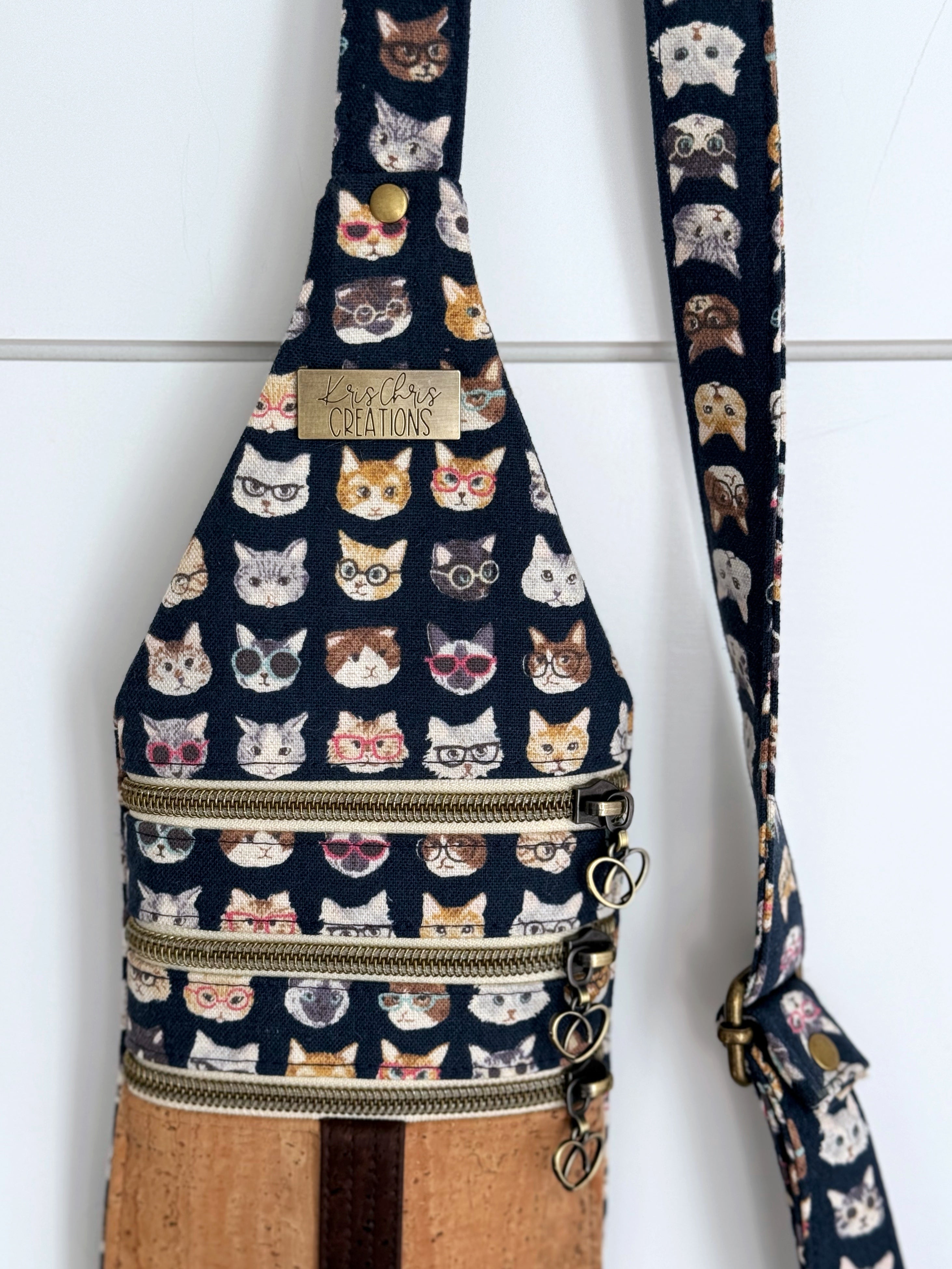 Cat bag with 3 zippers and KrisChris brass label. 