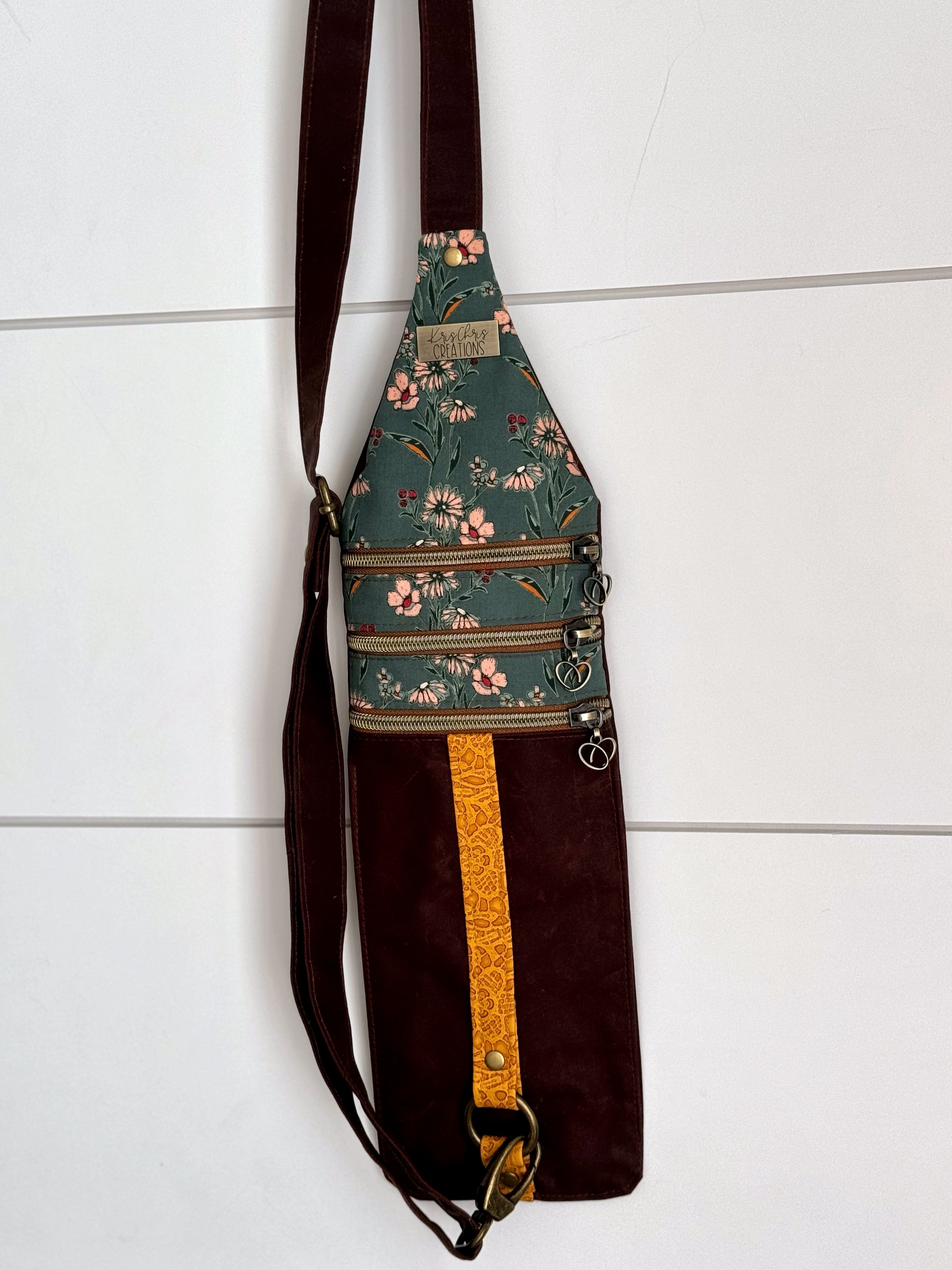 Crossbody bag hanging with white background