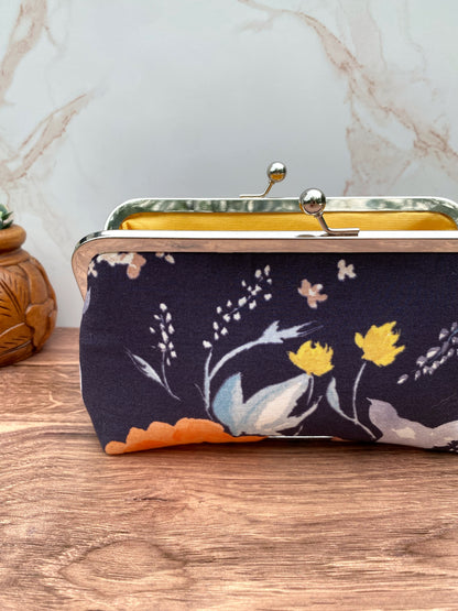 Navy clutch sewn from Nani Iro fabrics and yellow canvas interior with Silver Twist Lock Clasp