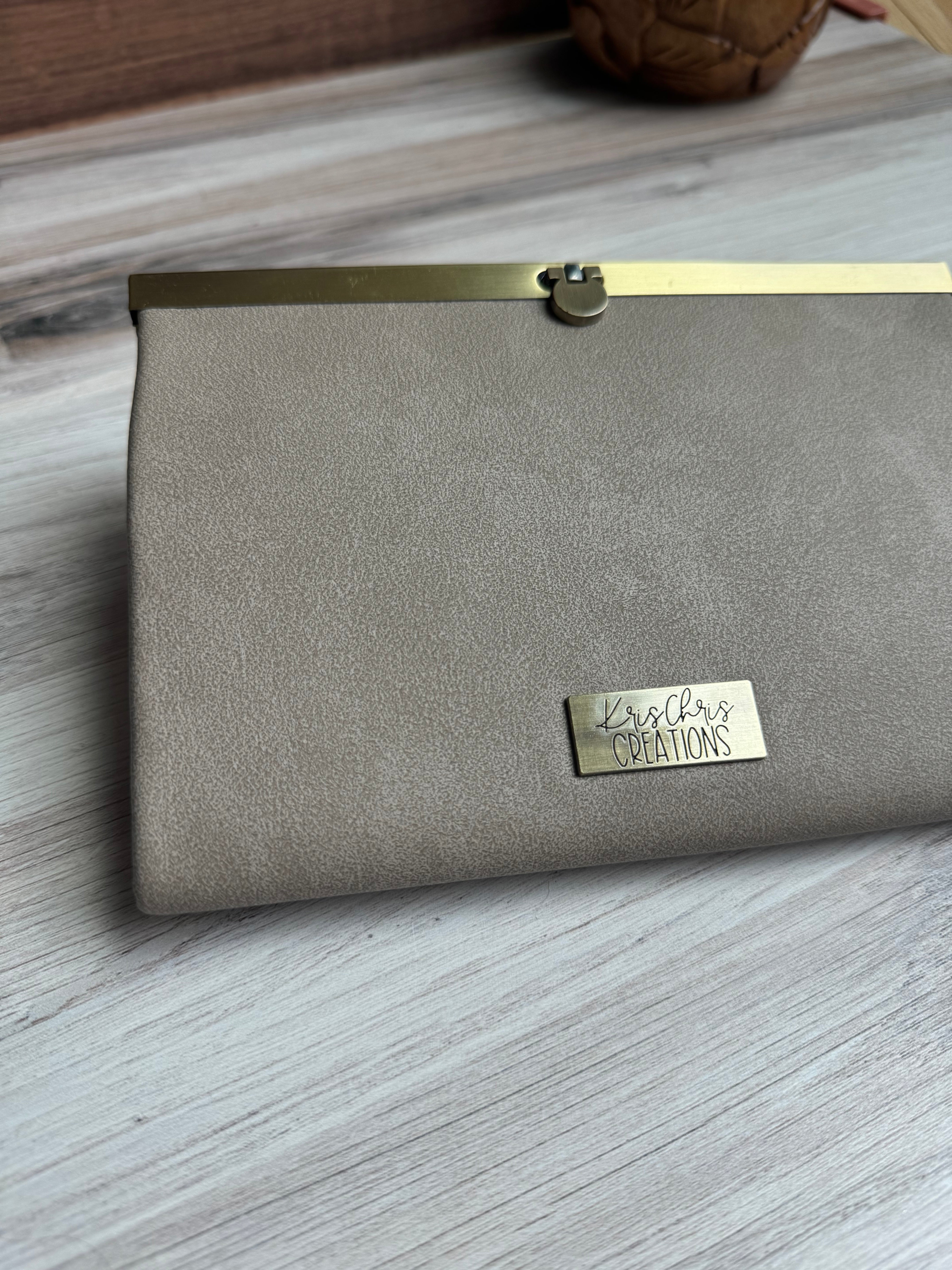 Gray/Tan accordion style wallet with a sleek exterior, antique brass metal clasp at top and coordinating KrisChris metal label.