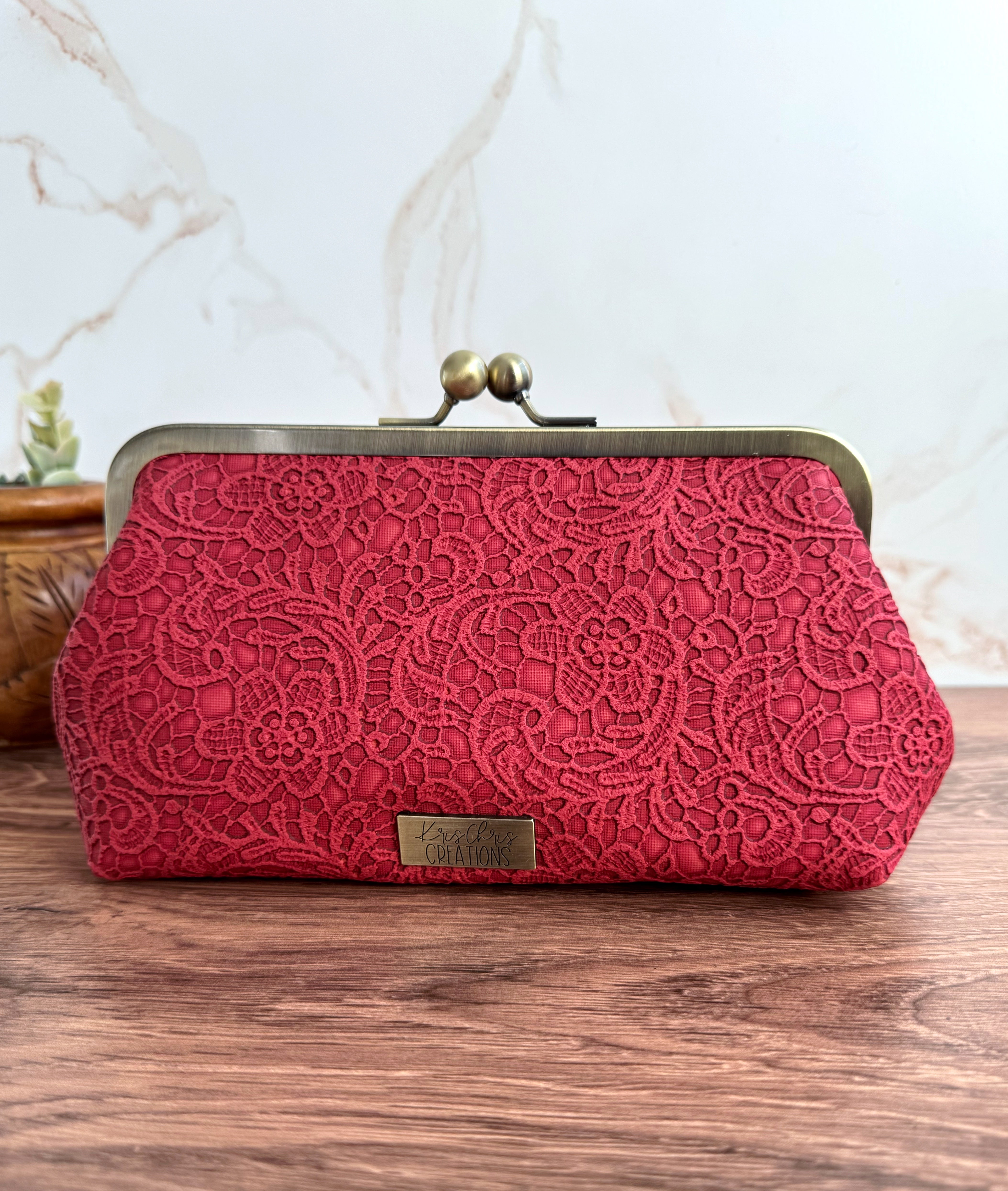 Lace vinyl clutch, red fabric with antique brass frame