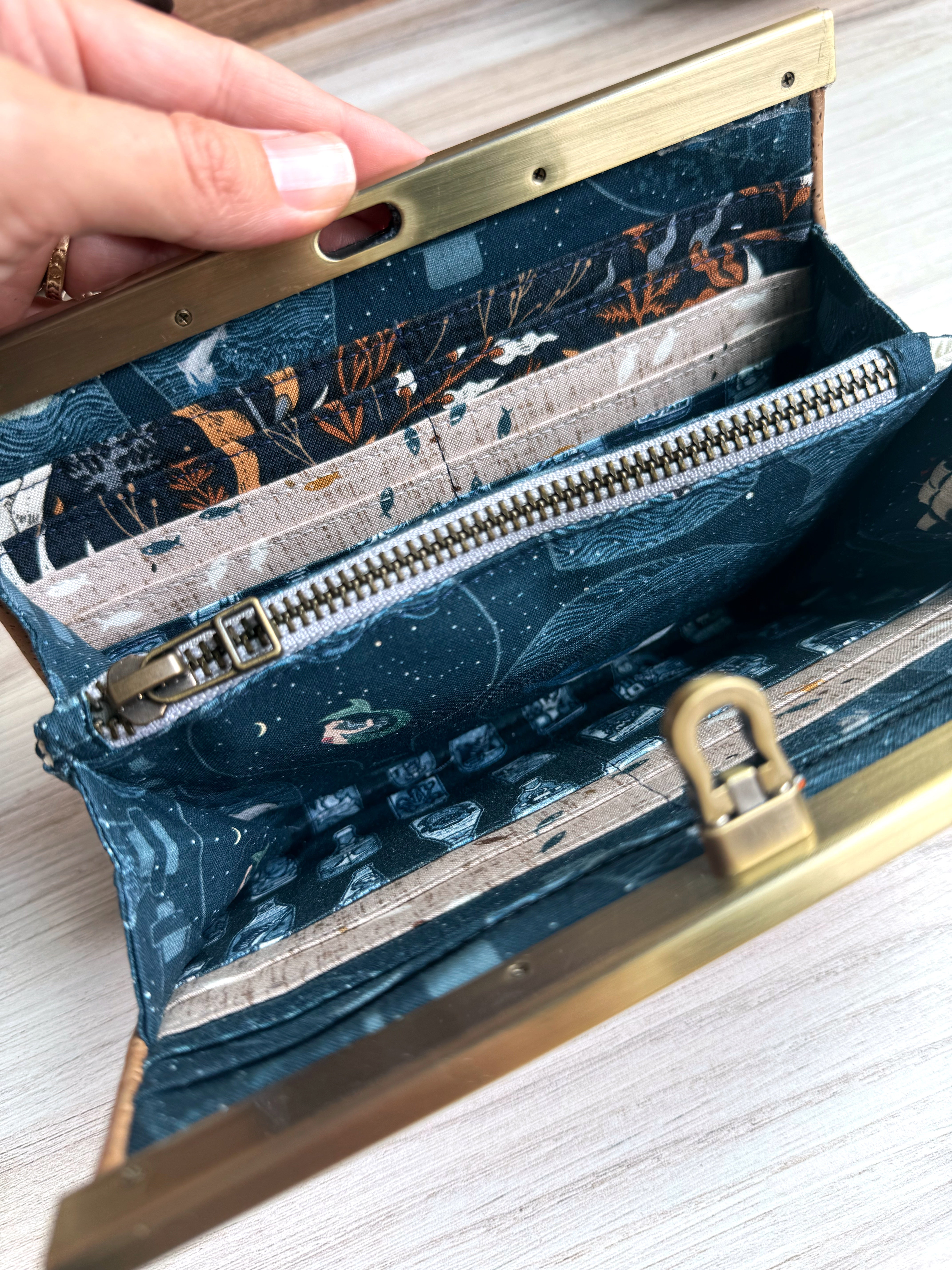 Open accordion wallet reveals interior ykk zipper, mermaids, pirate bottles, fish, and underwater vines with plenty of card slots